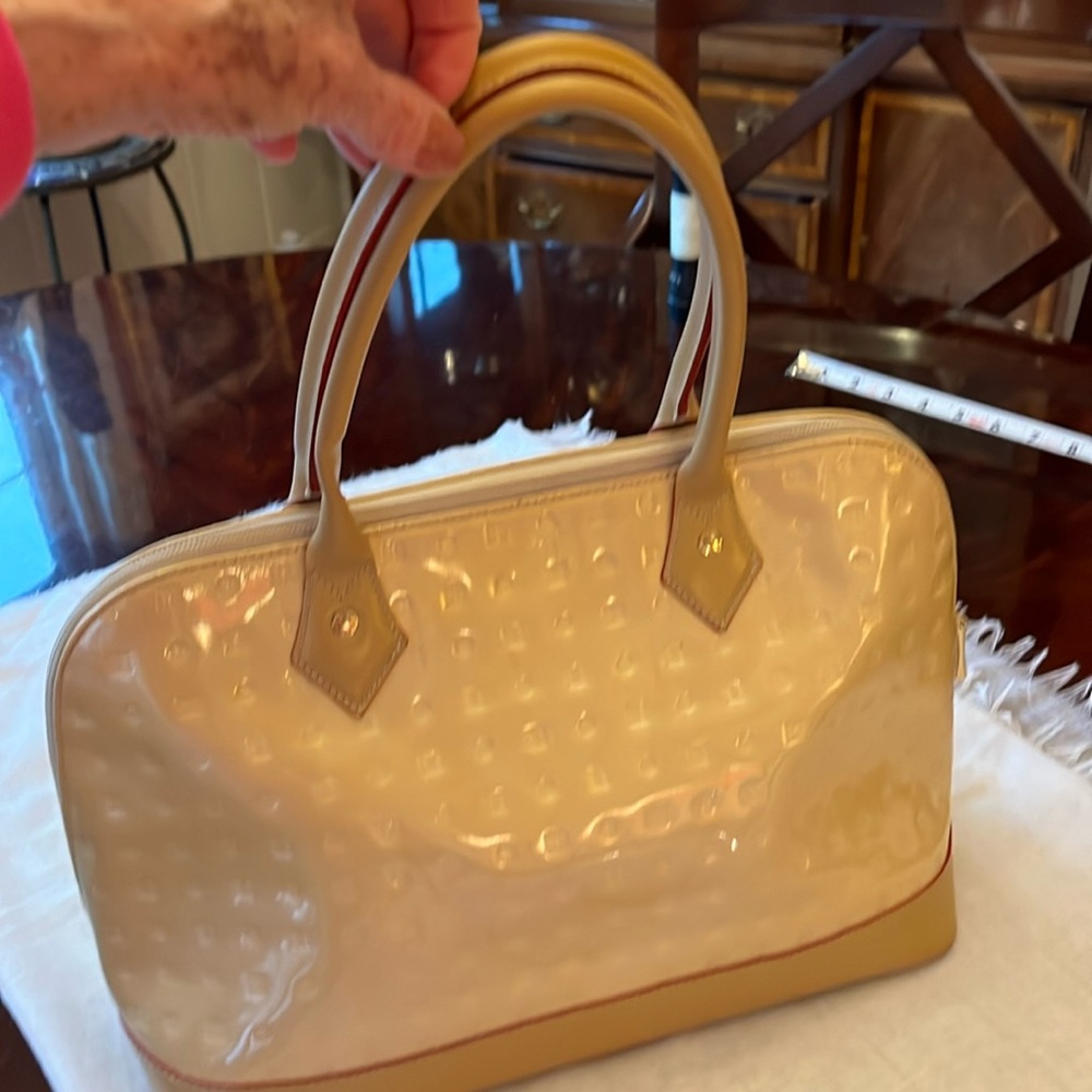 Arcadia patent leather dome satchel.